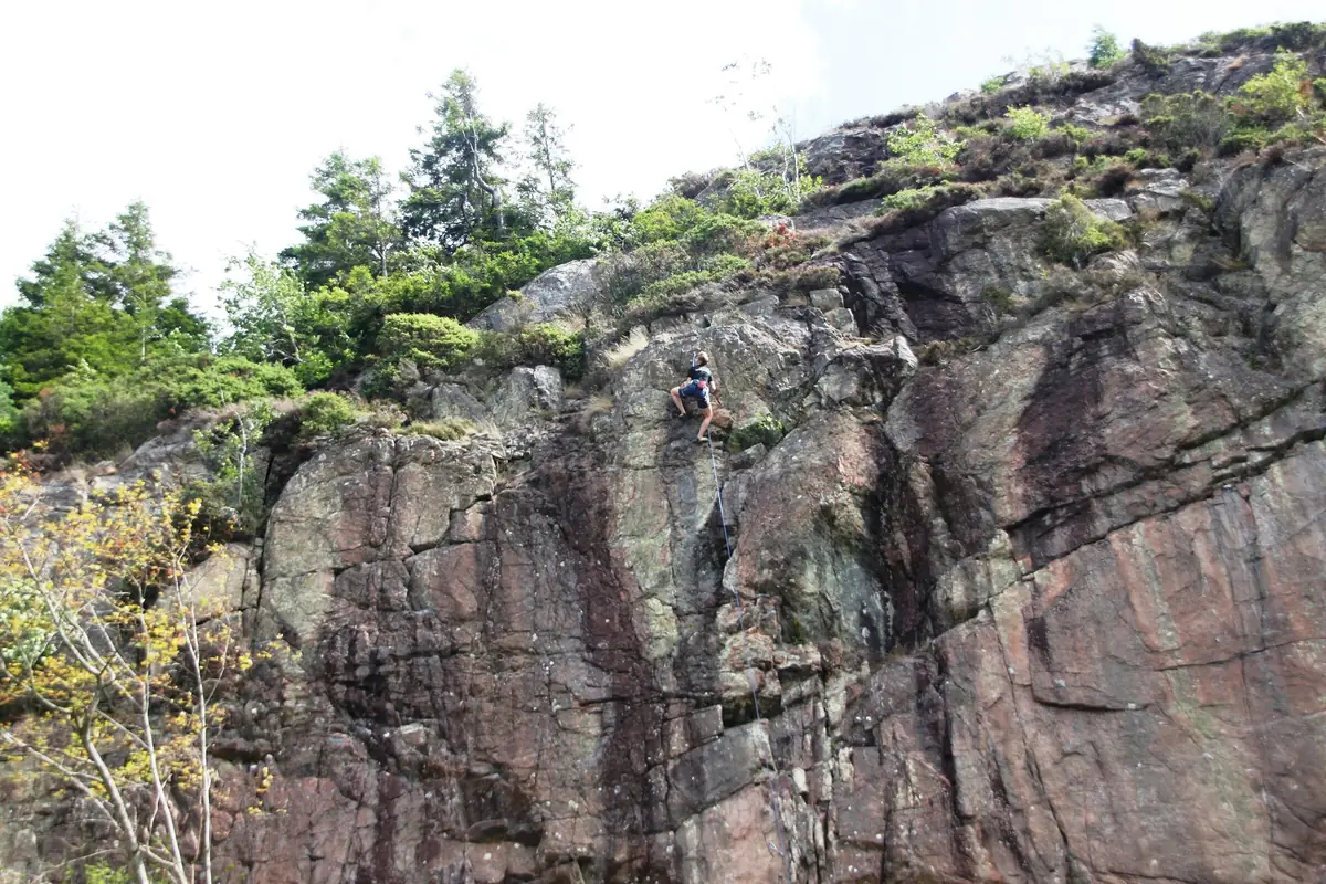 A climber on a granite crag in Bohuslän